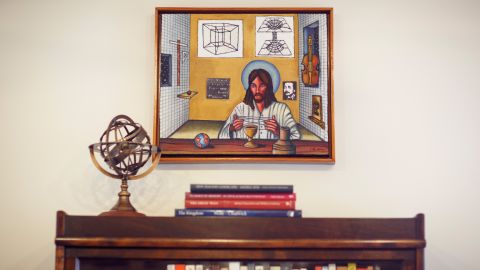A painting called "String Theory" by artist Charles Barbier is seen in Brown's library.