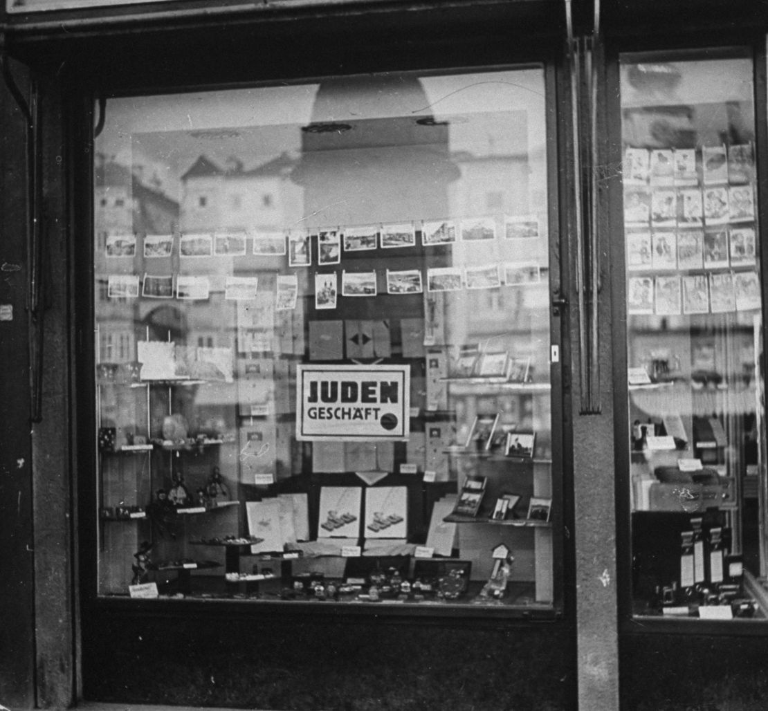 Nazi law required Jewish merchants to post signs saying their businesses were Jewish-owned.