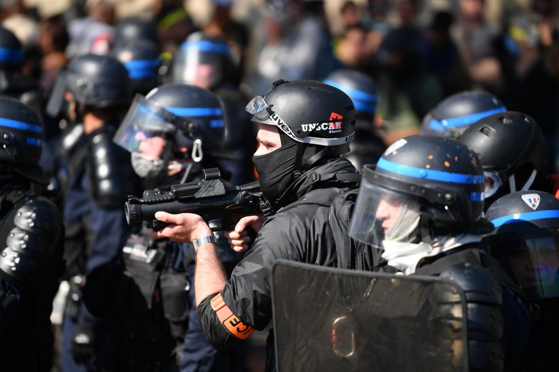 Officers counter protesters in Paris on April 20, 2019.