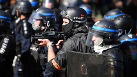 Officers counter protesters in Paris on April 20, 2019.