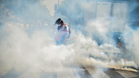 Yellow vest demonstrators light a fire as they gather in the Bercy neighborhood to protest for a 23rd week in Paris.