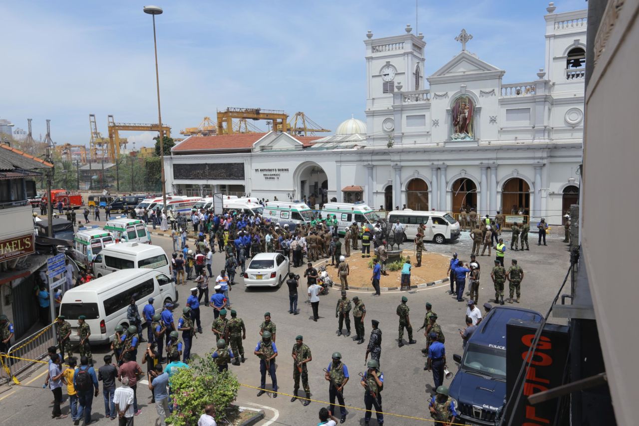 Sri Lankan military members stand guard outside St. Anthony's Church following an explosion.