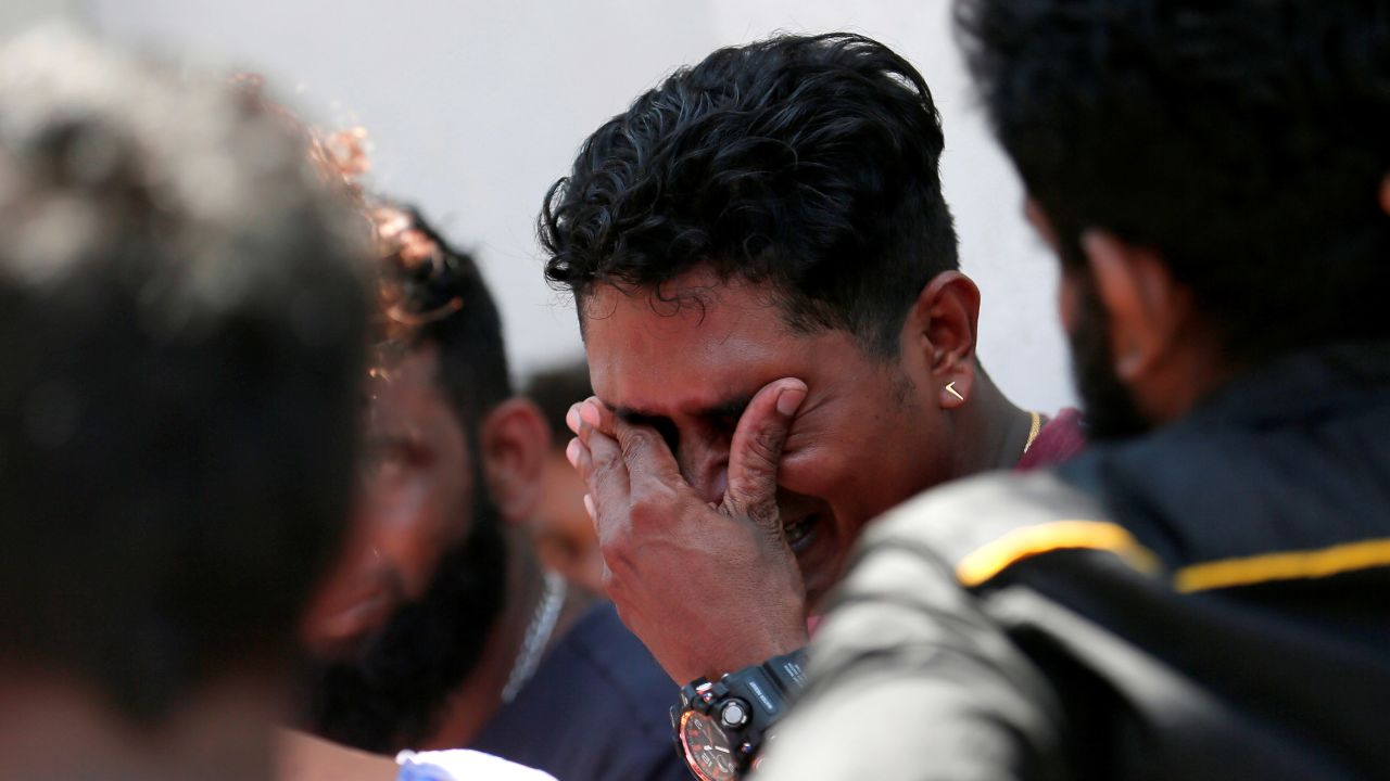 A relative of a victim of an explosion at St. Anthony's Shrine reacts outside the police mortuary in Colombo.  