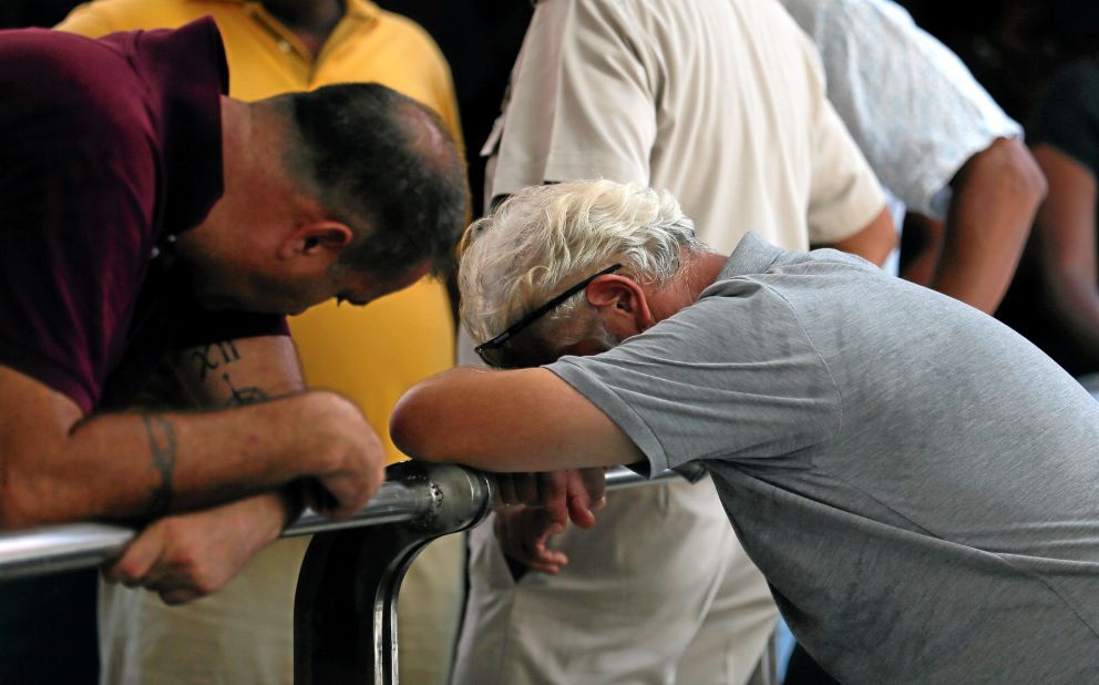 Relatives of a victim of the attacks react at the police mortuary in Colombo.