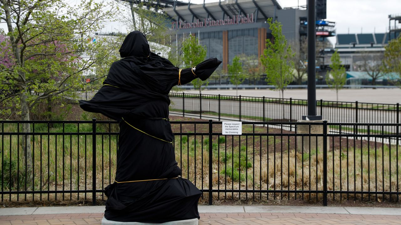 A covered statue of singer Kate Smith is seen near the Wells Fargo Center on April 19 in Philadelphia. 