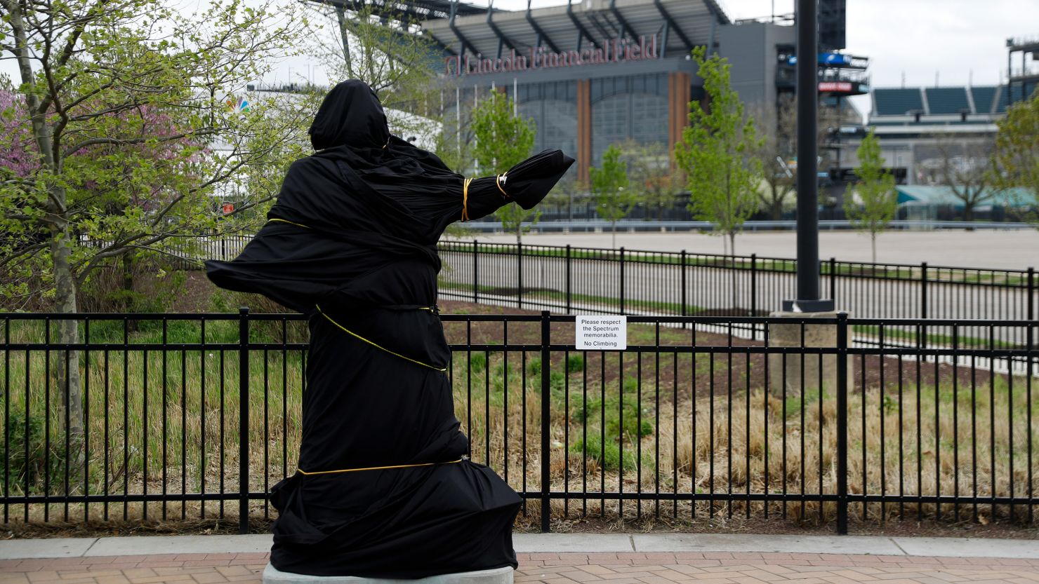 A statue of "God Bless America" singer Kate Smith outside the Philadelphia Flyers' arena was covered on Friday and then removed  Sunday morning.