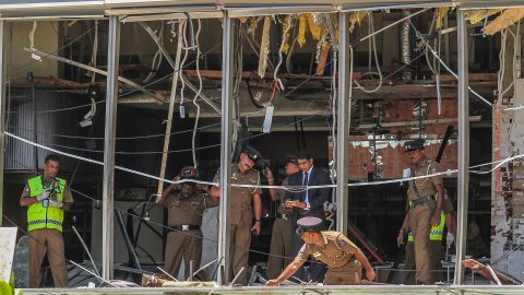 A Sri Lankan officer inspects a blast site at the Shangri-La hotel in Colombo.