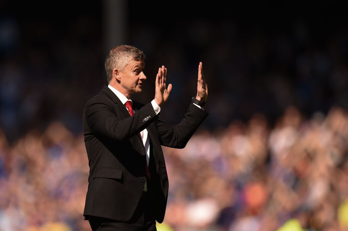 Manchester United manager Ole Gunnar Solskjaer apologizes to the traveling fans after the match.