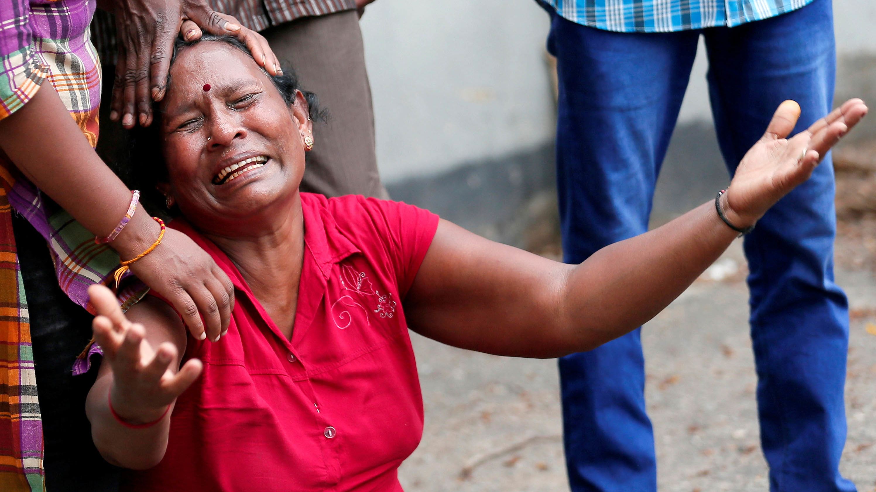 A woman is in tears after a deadly bomb blast at St. Anthony's Shrine in Sri Lanka's capital, Colombo, on Sunday.