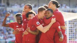 CARDIFF, WALES - APRIL 21:  Georginio Wijnaldum of Liverpool celebrates as he scores his team's first goal with Jordan Henderson and team mates during the Premier League match between Cardiff City and Liverpool FC at Cardiff City Stadium on April 21, 2019 in Cardiff, United Kingdom. (Photo by Mike Hewitt/Getty Images)