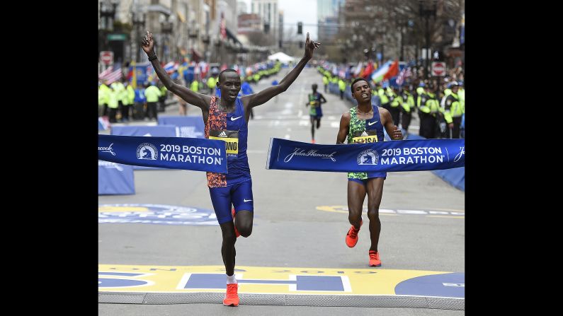 Lawrence Cherono of Kenya wins the men's race of the <a href="index.php?page=&url=https%3A%2F%2Fwww.cnn.com%2F2019%2F04%2F15%2Fsport%2F123rd-boston-marathon%2Findex.html" target="_blank">123rd Boston Marathon</a>, on Monday, April 15. Cherono beat out two-time Boston Marathon campion Lelisa Desisa of Ethiopia, at right.