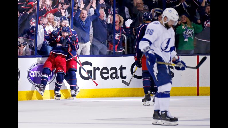 Artemi Panarin and Josh Anderson of the Columbus Blue Jackets celebrate after scoring an empty net goal in Game 4 of the First Round of the 2019 NHL Stanley Cup Playoffs against the Tampa Bay Lightning on Tuesday, April 16, in Columbus, Ohio. Columbus defeated Tampa Bay 7-3 to win the series 4-0. It was the <a href="index.php?page=&url=https%3A%2F%2Fbleacherreport.com%2Farticles%2F2831701-blue-jackets-win-1st-ever-playoff-series-with-historic-sweep-of-lightning" target="_blank" target="_blank">first ever playoff series win</a> for the Blue Jackets franchise.