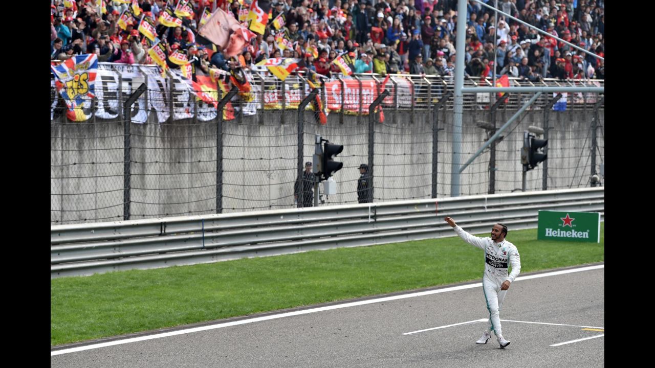 British driver Lewis Hamilton waves to fans after winning the Formula One Chinese Grand prix in Shanghai on Sunday, April 14.
