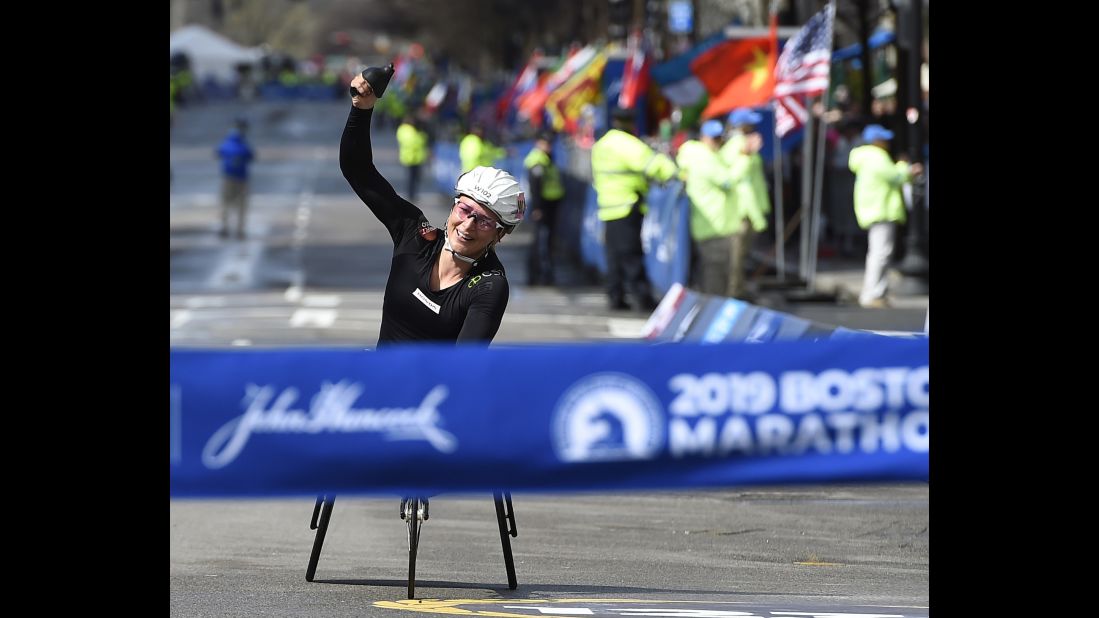 Manuella Schar of Switzerland celebrates before crossing the finish line to win the Women's Wheelchair Division of the 123rd Boston Marathon on Monday, April 15.