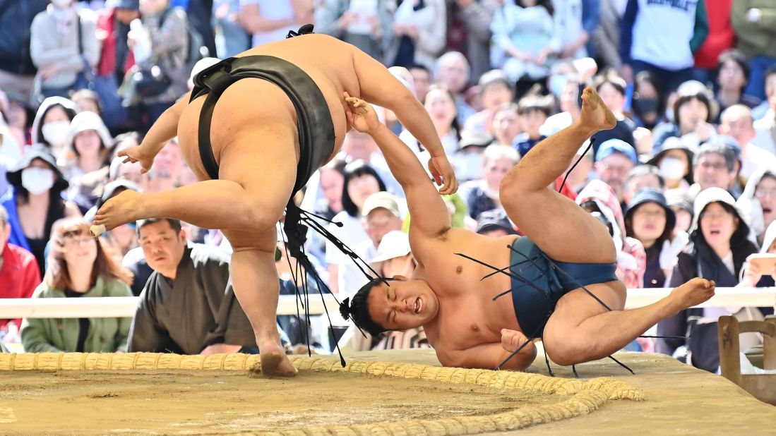 Sumo wrestlers take part in a "honozumo," a ceremonial sumo exhibition, on the grounds of Yasukuni Shrine in Tokyo on Monday, April 15. Some of Sumo's top wrestlers took part in the annual one-day exhibition.