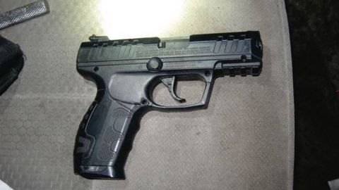 The realistic-looking airsoft pistol found in the fake deputy's vehicle.