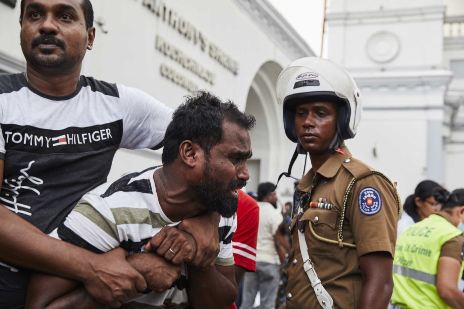 A man mourns after viewing the body of a dead relative killed in the bomb explosion at St. Anthony's Church in Colombo on Sunday, April 21.