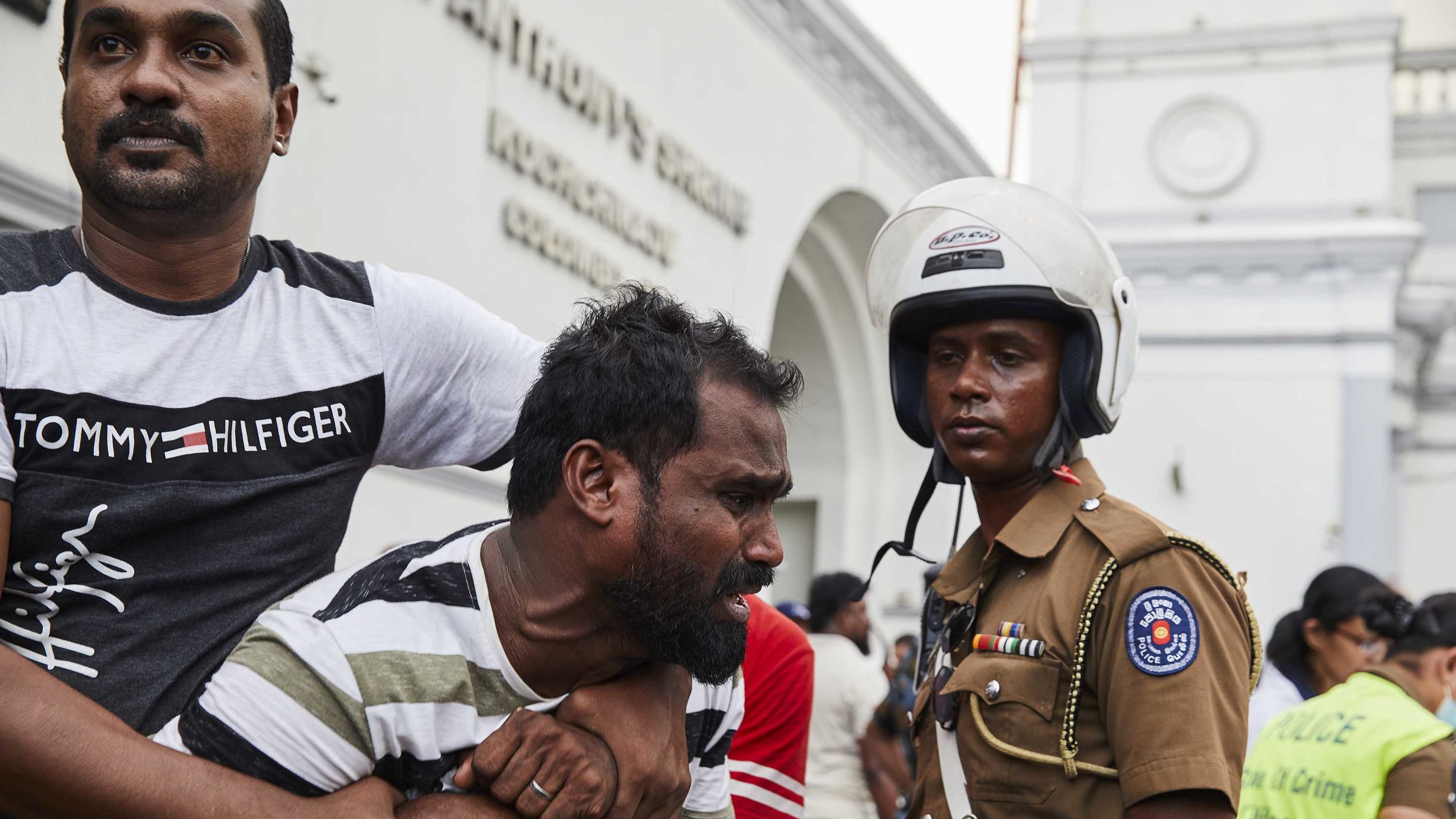 A man mourns after viewing the body of a dead relative killed in the bomb explosion at St. Anthony's Church in Colombo on Sunday, April 21.