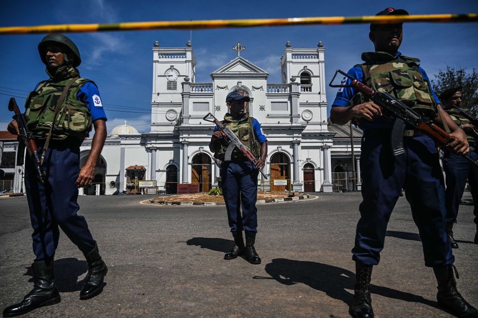 Security personnel stand guard outside St. Anthony's Shrine on Monday, a day after the church was hit in a series of bomb blasts targeting churches and luxury hotels in Sri Lanka.