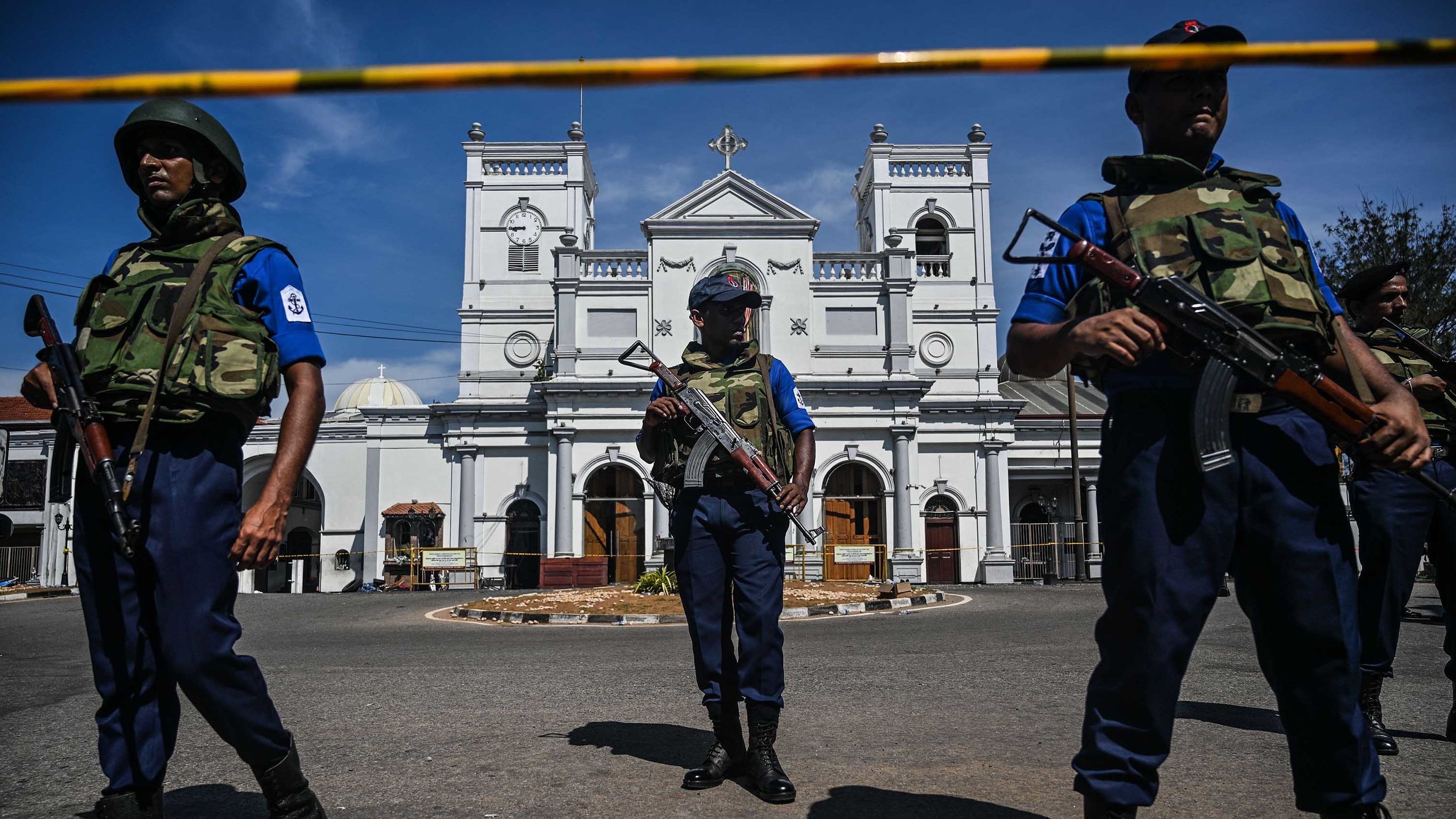 Security personnel stand guard outside St. Anthony's Shrine on Monday, a day after the church was hit in a series of bomb blasts targeting churches and luxury hotels in Sri Lanka.
