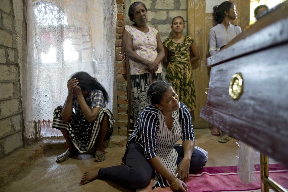 Relatives weep near the coffin of 12-year-old victim Sneha Savindi, who was killed in the Easter Sunday bombing at St. Sebastian's Church in Negombo, Sri Lanka.