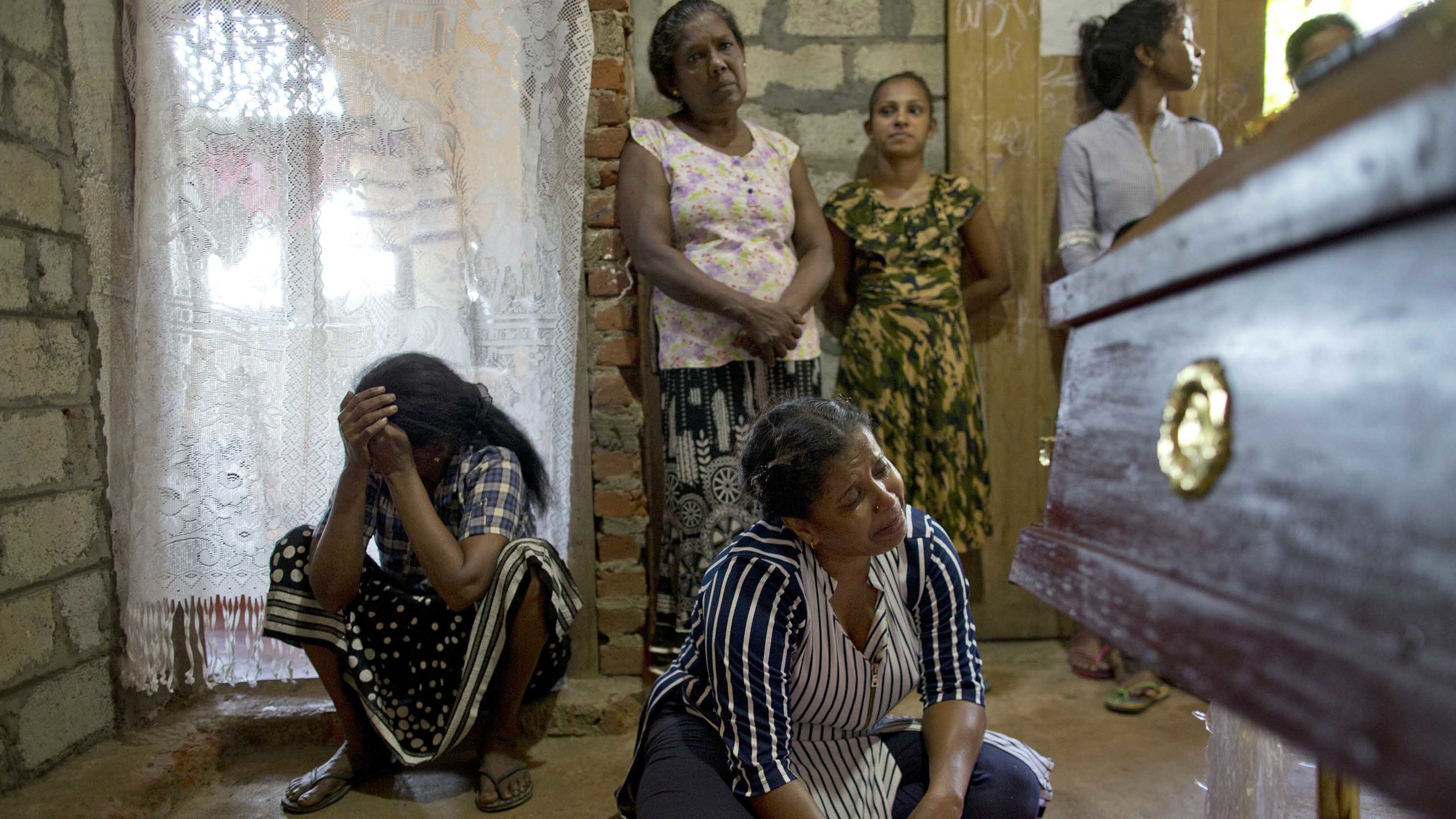 Relatives weep near the coffin of 12-year-old victim Sneha Savindi, who was killed in the Easter Sunday bombing at St. Sebastian's Church in Negombo, Sri Lanka.