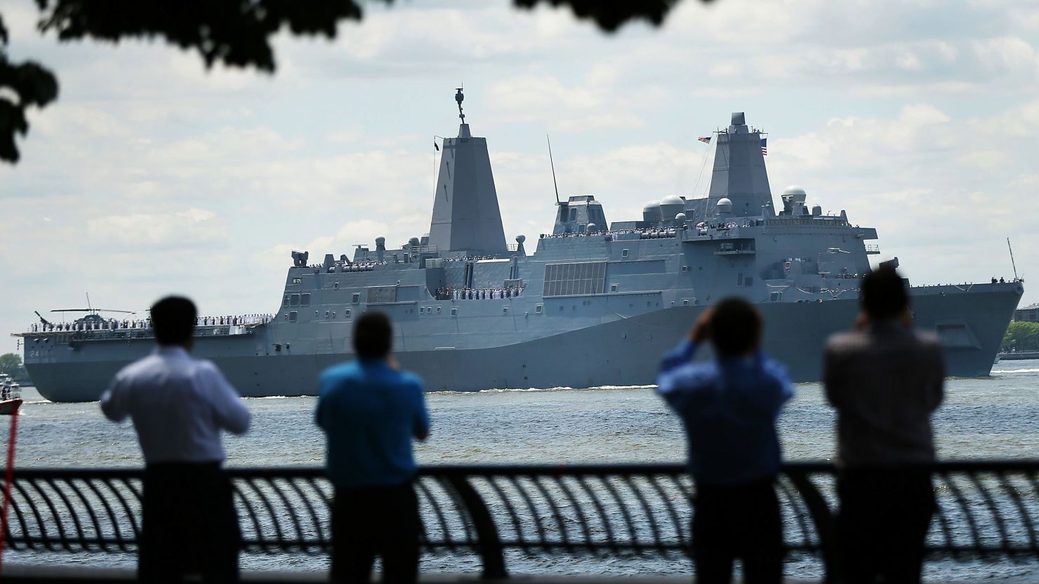 The Norfolk-based USS Arlington joins the Parade of Ships as it makes its way past the Statue of Liberty on the opening day of Fleet Week on May 23, 2018 in New York City.