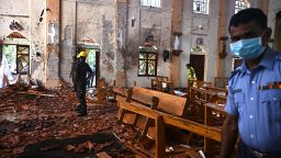 TOPSHOT - Security personnel inspect the interior of St Sebastian's Church in Negombo on April 22, 2019, a day after the church was hit in series of bomb blasts targeting churches and luxury hotels in Sri Lanka. - At least 290 are now known to have died in a series of bomb blasts that tore through churches and luxury hotels in Sri Lanka, in the worst violence to hit the island since its devastating civil war ended a decade ago. (Photo by Jewel SAMAD / AFP)        (Photo credit should read JEWEL SAMAD/AFP/Getty Images)