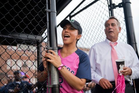 Gabbard and House Speaker John Boehner watch the Congressional Women's Softball Game in June 2013.
