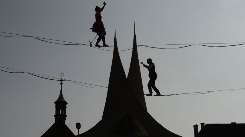 <strong>Prague: </strong>Tightrope artists are silhouetted on the skyline in front of the 14th-century Emmaus Monastery. The monastery is administrated by the Benedictine order. 