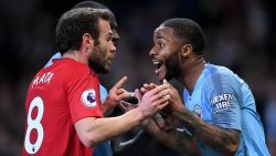 Juan Mata of Manchester United (L) argues with Raheem Sterling of Manchester City.