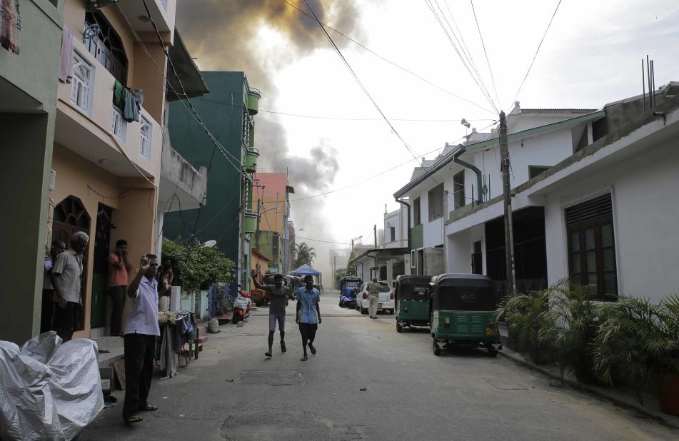 Smoke rises from the area where a van exploded on Monday near St. Anthony's shrine in Colombo.