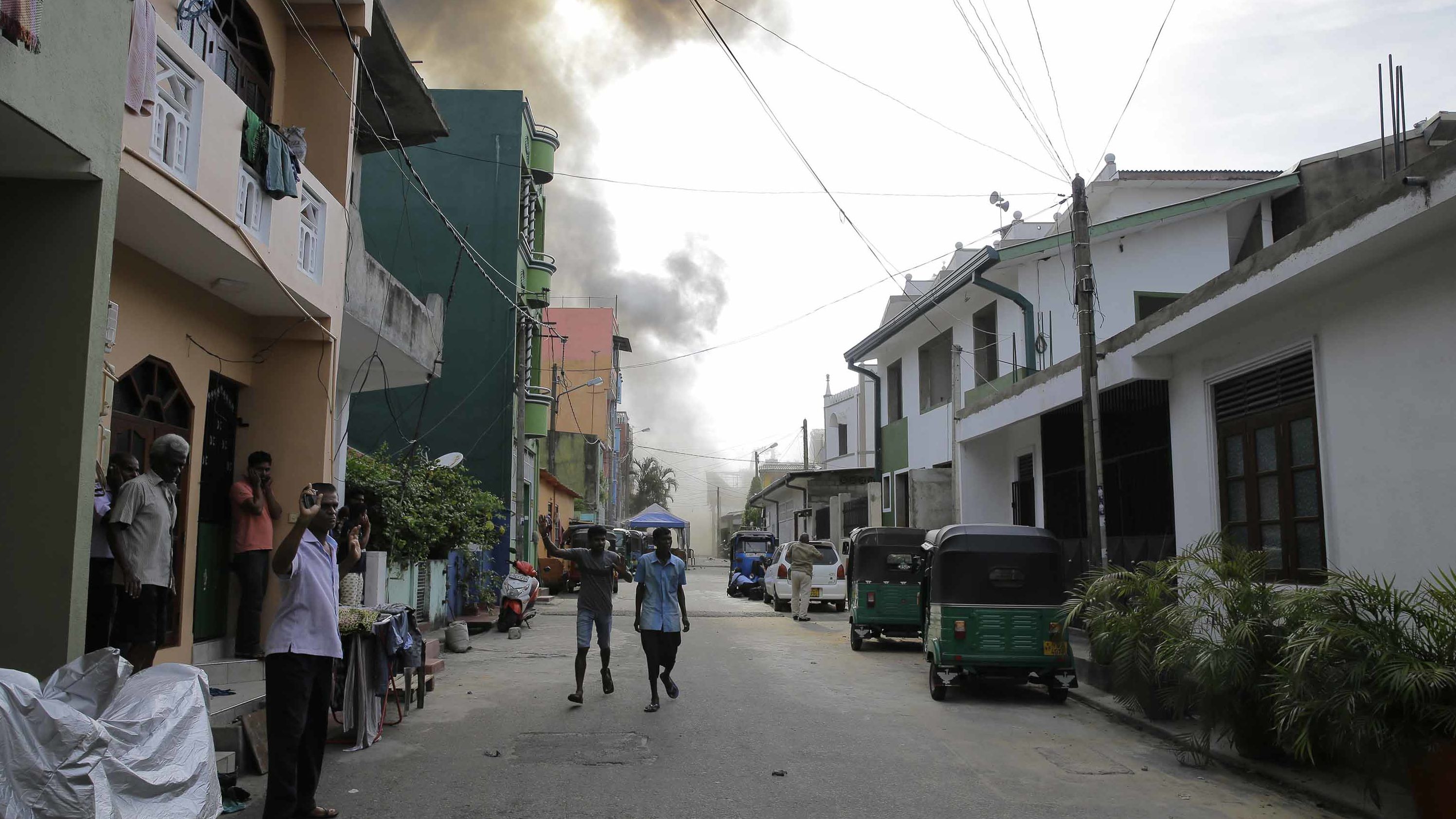 Smoke rises from the area where a van exploded on Monday near St. Anthony's shrine in Colombo.