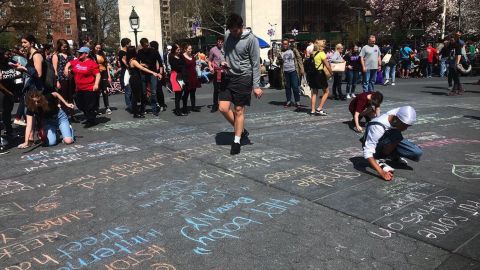 People gathered in NYC's Washington Square Park last month to 'chalk back' against street harassment. 
