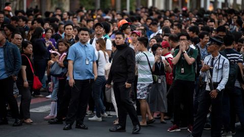 Employees seen in Manila, after an earthquake rocked high-rise buildings there.