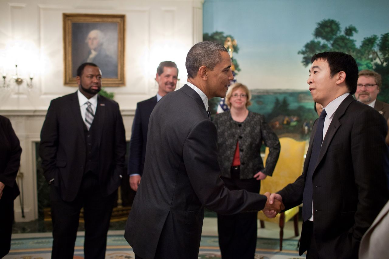 Yang is greeted by President Barack Obama in a White House reception room in 2012. Yang was among those honored as a "Champion of Change." He started Venture for America, a fellowship program that aims to connect recent college graduates with startups.