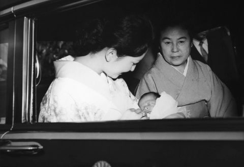 Naruhito is held by his mother, Crown Princess Michiko, after being born in Tokyo in February 1960. Naruhito's name means "a man who will acquire heavenly virtues."