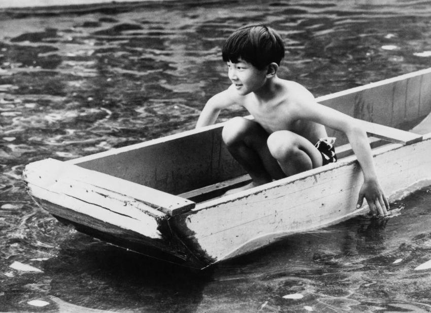 Naruhito paddles at the Children's Land playground in Yokohama, Japan, in June 1968.