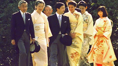 Emperor Akihito and Empress Michiko, left, lead their two sons, accompanied by their spouses, and a daughter during the annual autumn imperial garden party at Akasaka Palace in Tokyo in 1997.