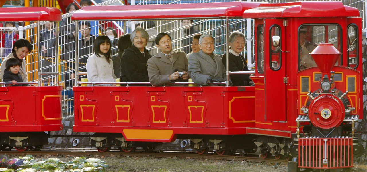 Naruhito is joined by his parents and other family members during a park visit in 2009.