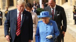WINDSOR, ENGLAND - JULY 13:  Queen Elizabeth II and President of the United States, Donald Trump walk from the Quadrangle after inspecting an honour guard at Windsor Castle on July 13, 2018 in Windsor, England.  Her Majesty welcomed the President and Mrs Trump at the dais in the Quadrangle of the Castle. A Guard of Honour, formed of the Coldstream Guards, gave a Royal Salute and the US National Anthem was played. The Queen and the President inspected the Guard of Honour before watching the military march past. The President and First Lady then joined Her Majesty for tea at the Castle.  (Photo by Chris Jackson/Getty Images)