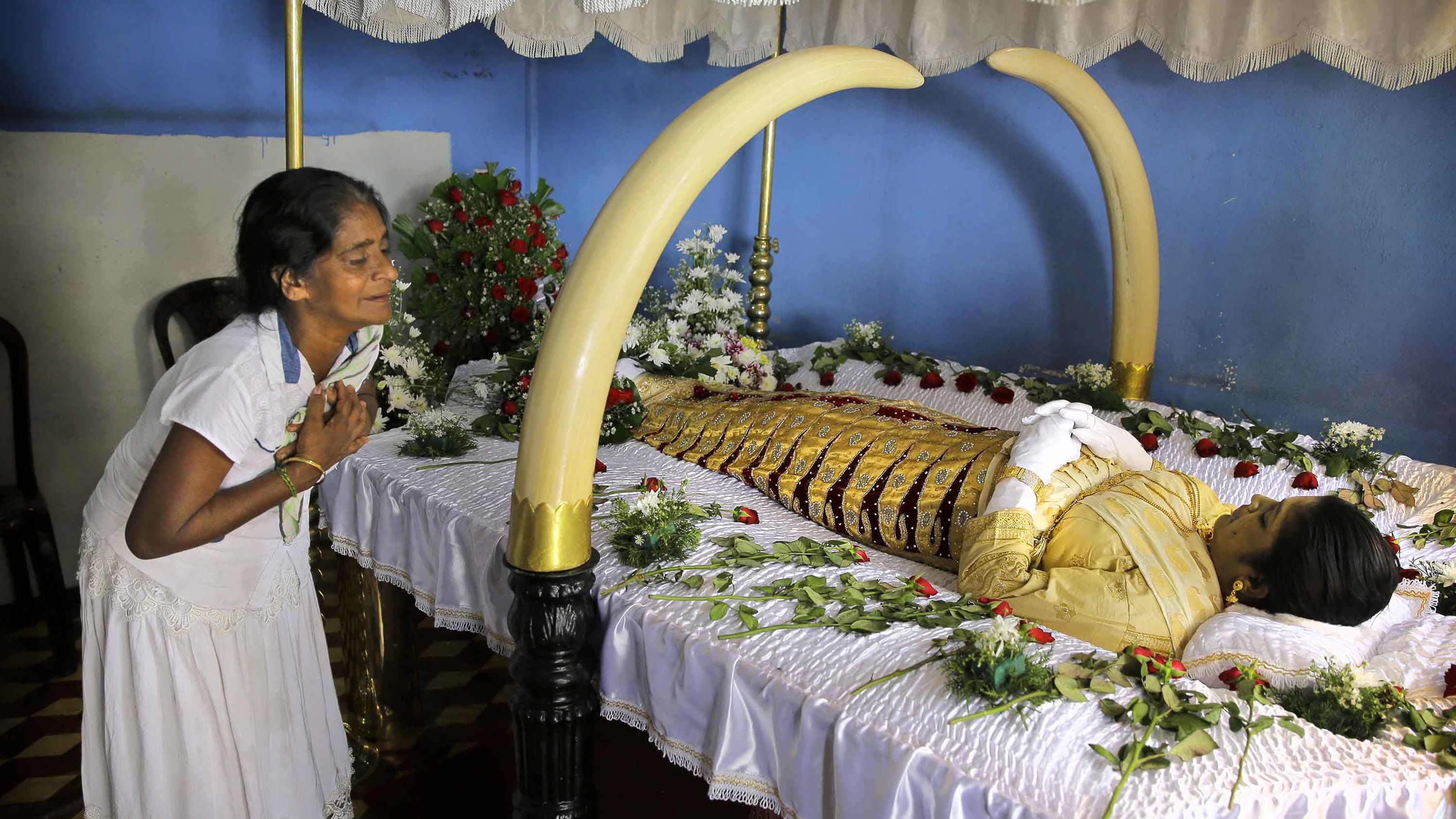 On Tuesday, April 23, Harshani Sriyani weeps over the body of her daughter who was killed in the Easter Sunday bombings in Colombo.
