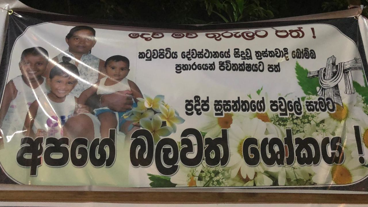 Posters with photos of blast victims are seen outside St Sebastian Church in Negombo. This one reads, 'Rest in peace for Pradeep Susanthas and his whole family, who were killed in the church attack. Our deepest sympathies.'