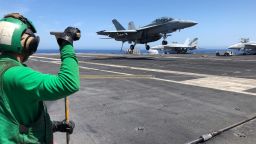 A US Navy F-18 Hornet shortly before landing on the deck of the USS Abraham Lincoln.