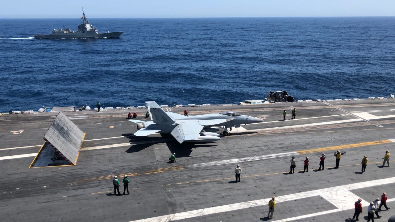 A F/A-18 Super Hornet waits to take off from the deck of the USS Abraham Lincoln in the Mediterranean Sea.