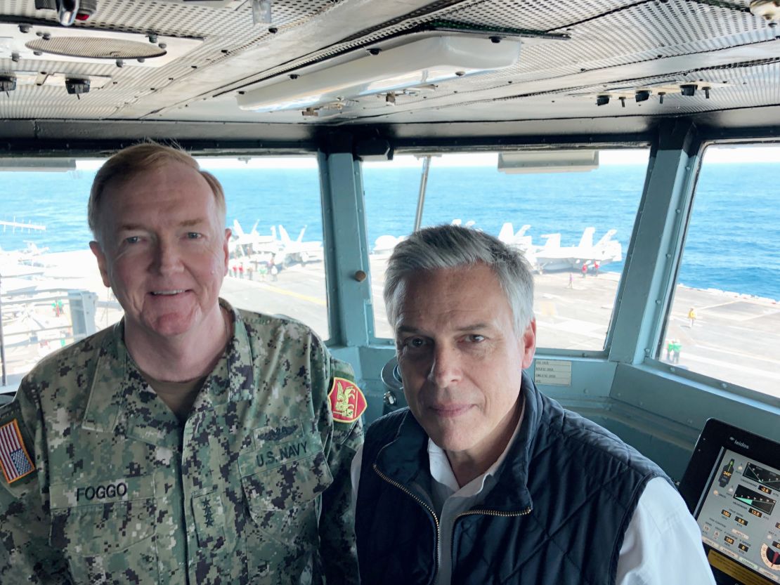 Adm. James Foggo and Ambassador Jon Huntsman on the bridge of the USS Abraham Lincoln.