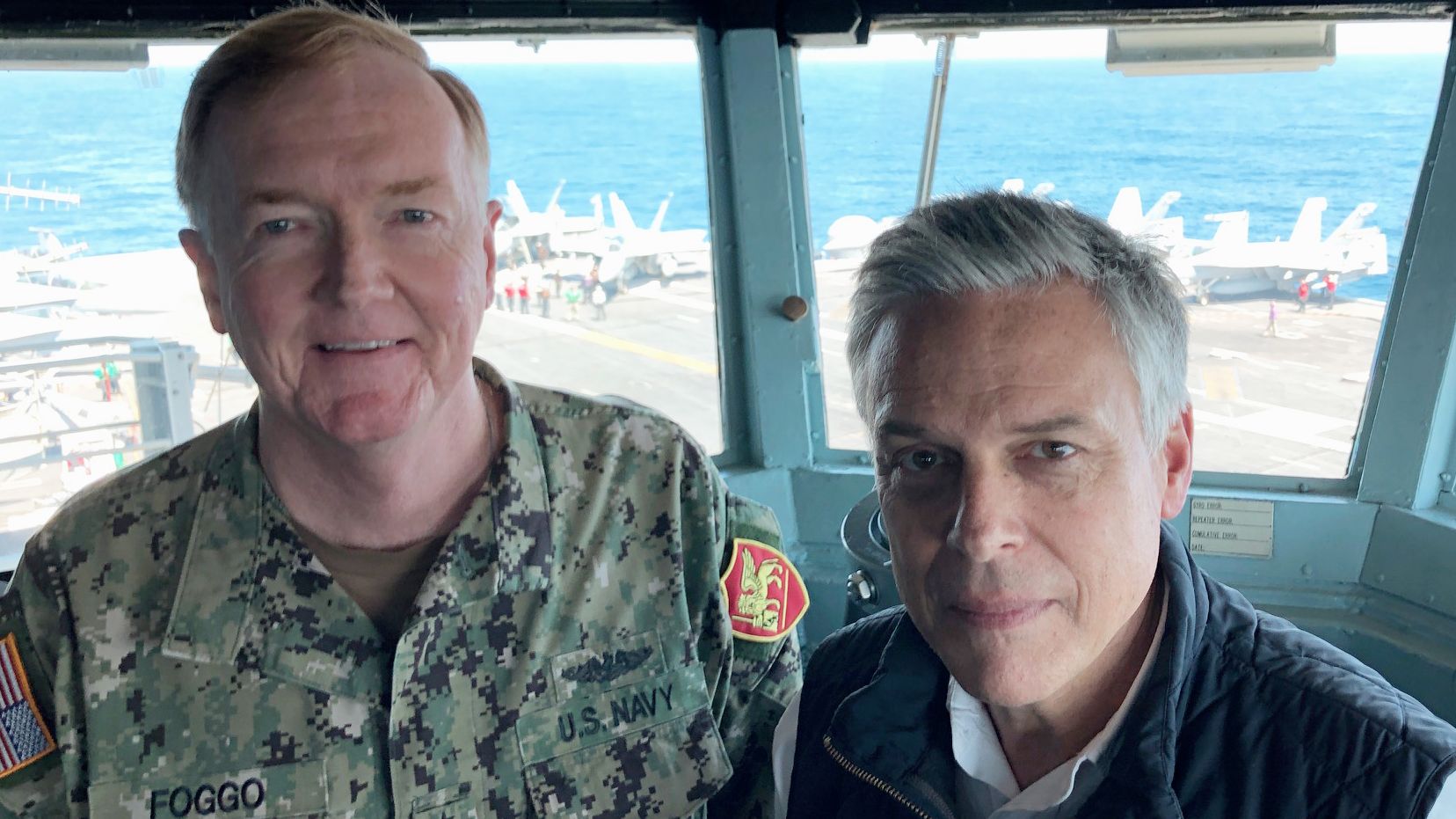 Adm. James Foggo and Ambassador Jon Huntsman on the bridge of the USS Abraham Lincoln.