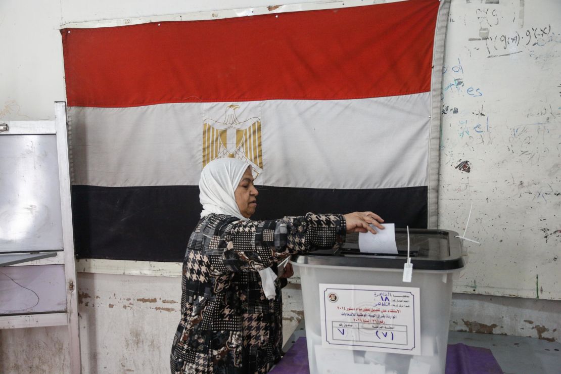 A woman casts her ballot in Cairo.