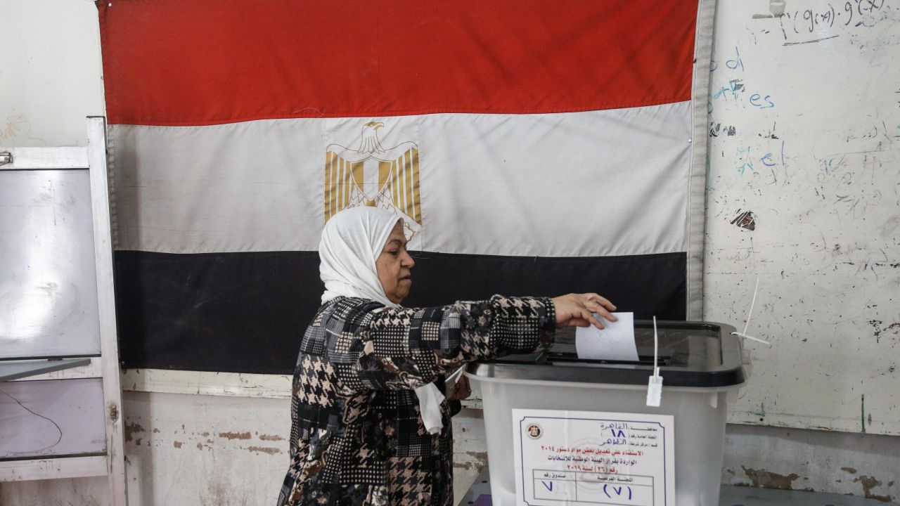 A woman casts her ballot in Cairo.