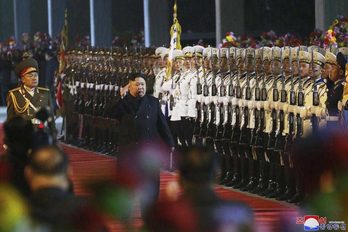 In this photo provided by the North Korean government, North Korean leader Kim Jong Un inspects an honor guard at an undisclosed train station in North Korea on Wednesday before leaving for Russia.